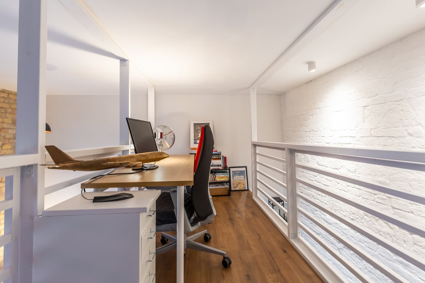 Large loft dining area with brick wall